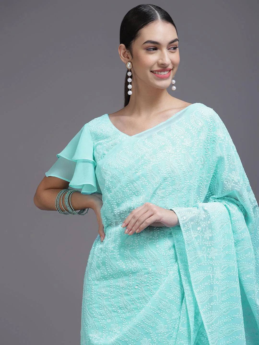 Turquoise Blue Embroidered Georgette Saree - Libas 